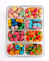 Sweet Feasts Candy Boards variety snackle box filled with colourful assorted sweets including candy pizza and gummies.