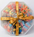 Sweet Feasts Candy Boards gummy sweet platter in an octagonal tray with a gold branded ribbon and gift tag