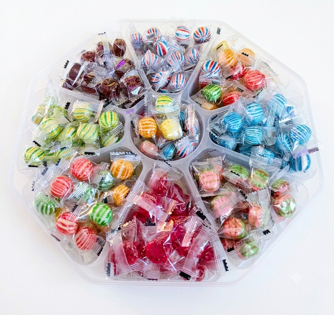 Sweet Feasts Candy Boards octagonal platter filled with an assortment of individually wrapped colourful hard candies.