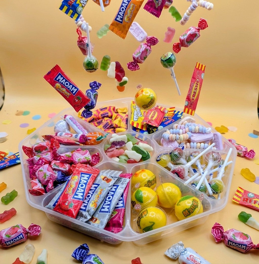 Sweet Feasts Candy Boards assorted retro sweet platter featuring lollipops, fruit chews, and gummies in a clear tray.